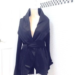 G.E.T. Black wrap jacket.Rayon/Nylon. Satin lined. Pockets. Size Medium.